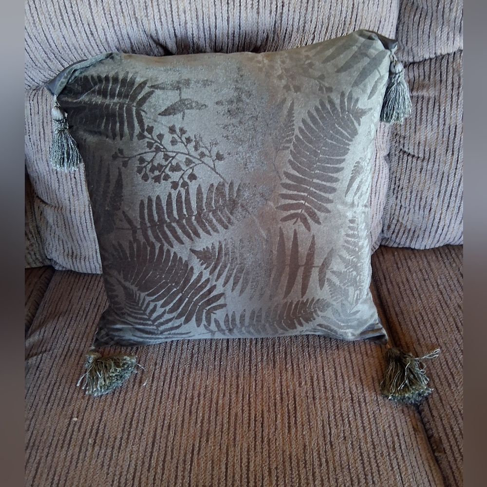 Velvet throw pillow with a fern pattern. 